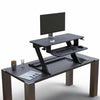 Solace Desktop raised to standing height with monitor and keyboard