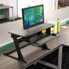 Workrite Solace Desktop standing desk converter on an office desk with a monitor
